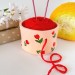 Small beige crochet yarn holder bowl with red tulip flowers Knitter gifts