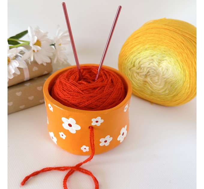 Small orange crochet yarn holder bowl with retro daisy flowers Knitter gifts