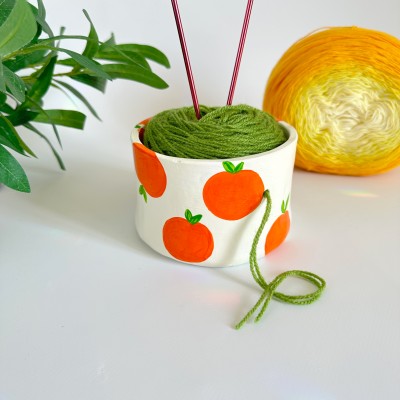 Small crochet yarn bowl with oranges