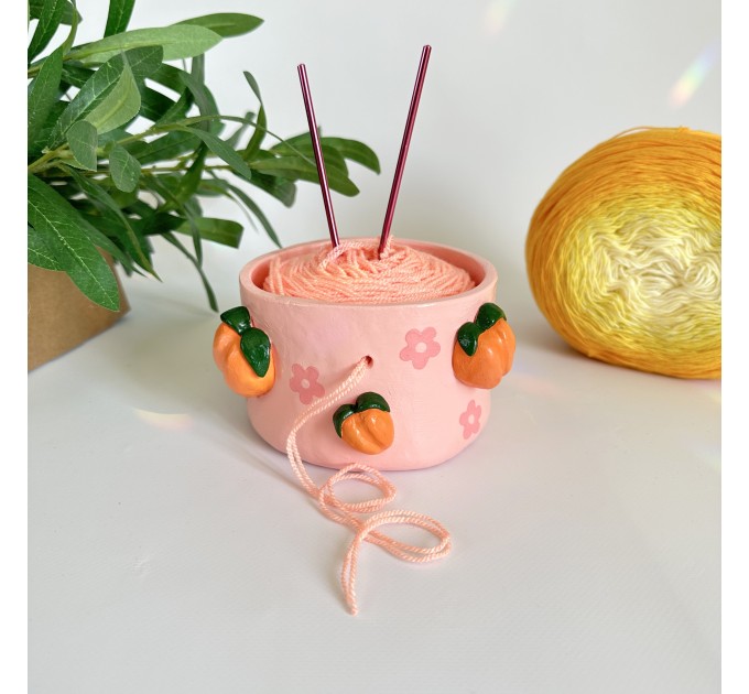 Small crochet yarn bowl with peach and daisy flowers and daisy flowers