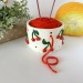 Small milky white crochet yarn holder bowl with red cherries and dots Knitters crocheters