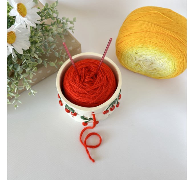 Small milky white crochet yarn holder bowl with red cherries and dots Knitters crocheters