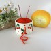 Small milky white crochet yarn holder bowl with red cherries and dots Knitters crocheters