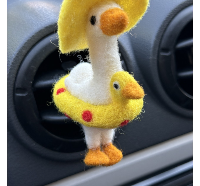 Summer goose with sun hat and yellow duck swim ring air vent clip
