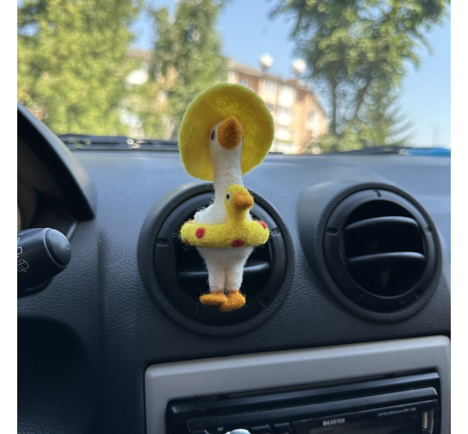 Summer goose with sun hat and yellow duck swim ring air vent clip