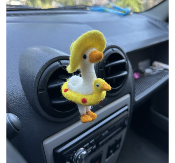 Summer goose with sun hat and yellow duck swim ring air vent clip