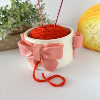 Small milky white crochet yarn holder bowl with pink coquette bows Knitters crocheters