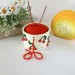 Small milky white crochet yarn holder bowl with red cherries and dots Knitters crocheters