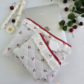 Laptop sleeve with cherries and ruffles