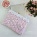 Soft pink laptop sleeve with ruffles, bows and pearl-like beads
