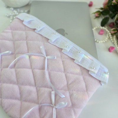 Soft pink laptop sleeve with ruffles, bows and pearl-like beads