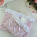 Soft pink laptop sleeve with ruffles, bows and pearl-like beads