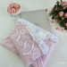 Soft pink laptop sleeve with ruffles, bows and pearl-like beads