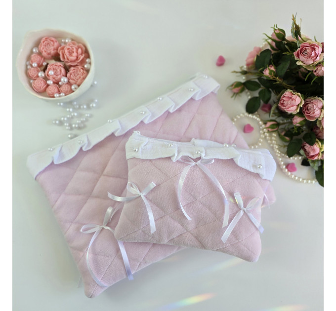 Soft pink laptop sleeve with ruffles, bows and pearl-like beads