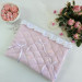 Soft pink laptop sleeve with ruffles, bows and pearl-like beads