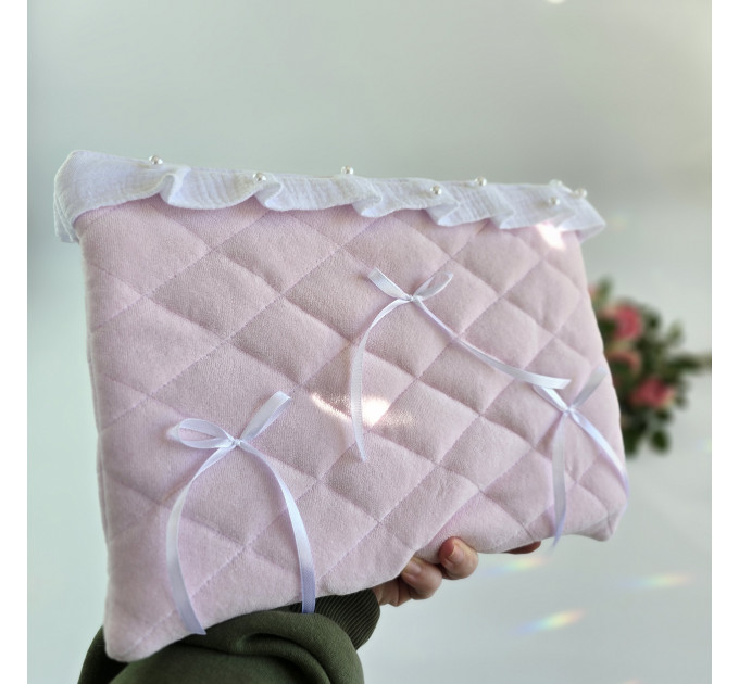 Soft pink laptop sleeve with ruffles, bows and pearl-like beads