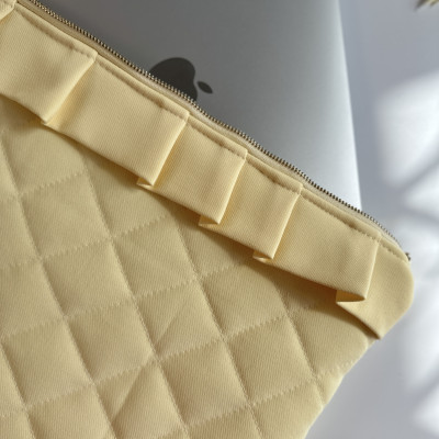 Butter yellow laptop sleeve with ruffles