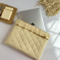 Butter yellow laptop sleeve with ruffles