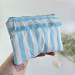 Sky-blue striped E-reader sleeve with ruffles