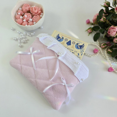 Soft pink E-reader sleeve with ruffles, bows and pearl-like beads
