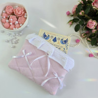 Soft pink E-reader sleeve with ruffles, bows and pearl-like beads