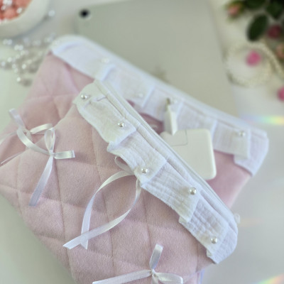 Soft pink tablet sleeve with ruffles, bows and pearl-like beads
