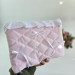 Soft pink tablet sleeve with ruffles, bows and pearl-like beads