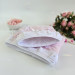 Soft pink tablet sleeve with ruffles, bows and pearl-like beads