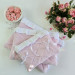 Soft pink tablet sleeve with ruffles, bows and pearl-like beads