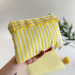 Yellow striped laptop sleeve with ruffles