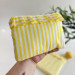 Yellow striped tablet sleeve with ruffles