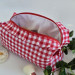 Large red gingham cosmetic bag with ruffles