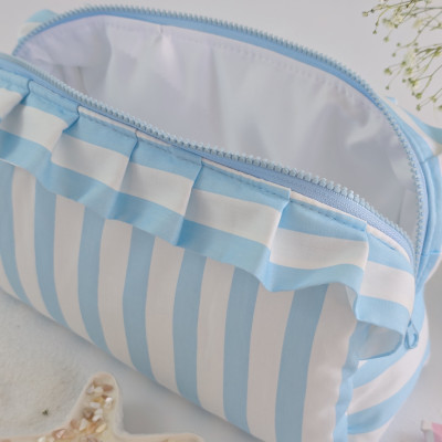 Large sky-blue striped cosmetic bag with ruffles