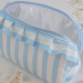 Large sky-blue striped cosmetic bag with ruffles