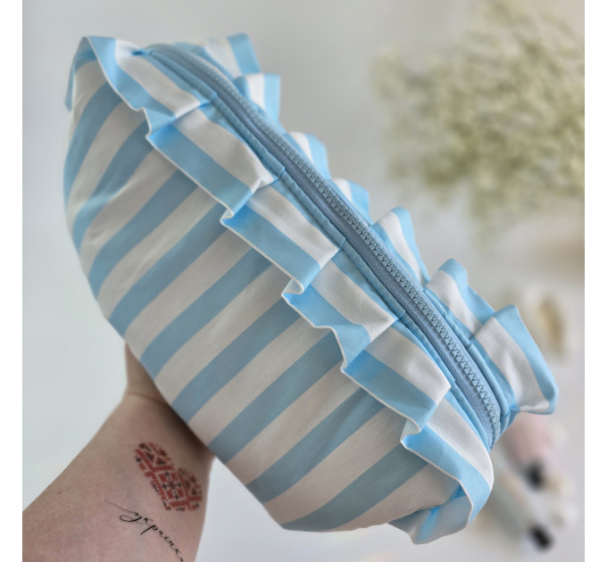 Large sky-blue striped cosmetic bag with ruffles