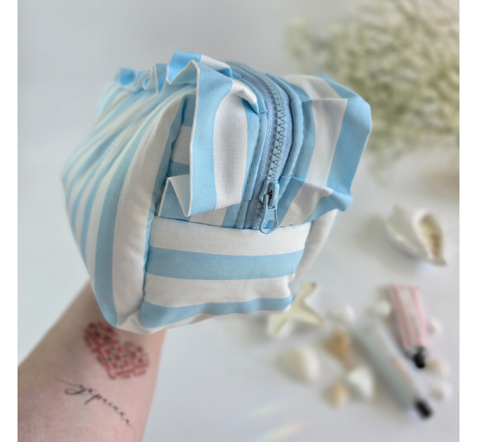 Large sky-blue striped cosmetic bag with ruffles