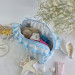 Large sky-blue striped cosmetic bag with ruffles