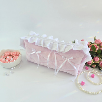 Large soft pink cosmetic bag with ruffles, bows and pearl-like beads