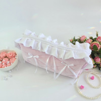 Large soft pink cosmetic bag with ruffles, bows and pearl-like beads