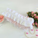 Large soft pink cosmetic bag with ruffles, bows and pearl-like beads