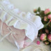 Large soft pink cosmetic bag with ruffles, bows and pearl-like beads