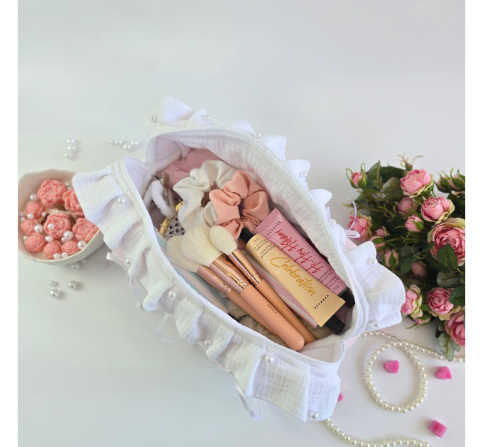 Large soft pink cosmetic bag with ruffles, bows and pearl-like beads