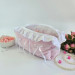 Large soft pink cosmetic bag with ruffles, bows and pearl-like beads