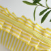 Large yellow striped cosmetic bag with ruffles