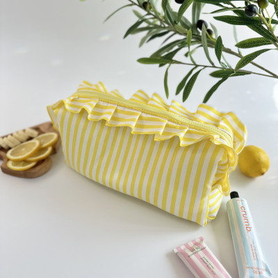 Large yellow striped cosmetic bag with ruffles