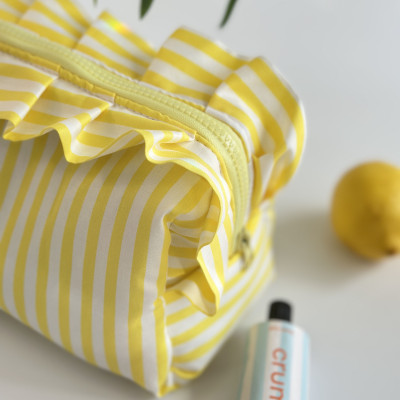 Large yellow striped cosmetic bag with ruffles