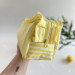 Large yellow striped cosmetic bag with ruffles