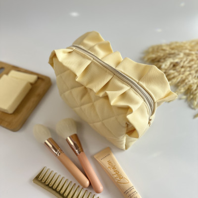 Medium butter yellow cosmetic bag with ruffles