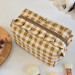 Medium checkered brown cosmetic bag with ruffles