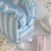 Medium sky-blue striped cosmetic bag with ruffles